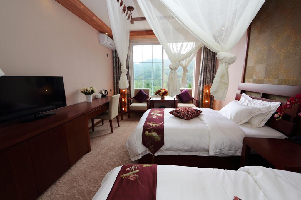 Panshan Tingquan Tuwo Holiday Resort Лэшань Номер фото